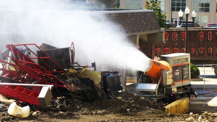 Atomized mist dust control system at demolition site