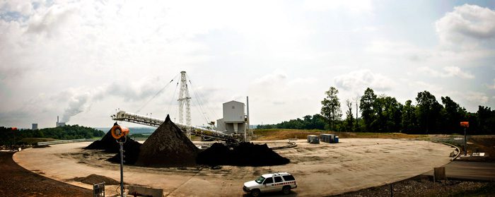 tower mounted dust control machines aimed at fly ash stockpile