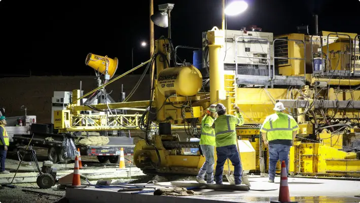 Workers on cement job site with dustboss