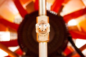 Odor control atomizing nozzle