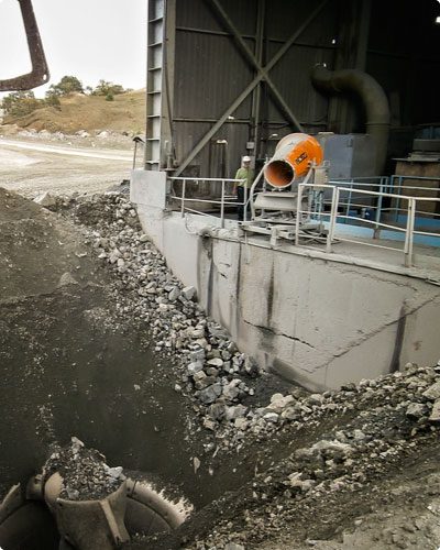 Truck Dump Dust Suppression With Worker And DustBoss Cannon