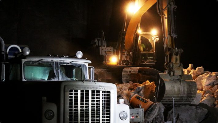 Mining with dust control system and excavator