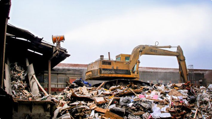 CD debris at transfer station with dust control system throwing mist