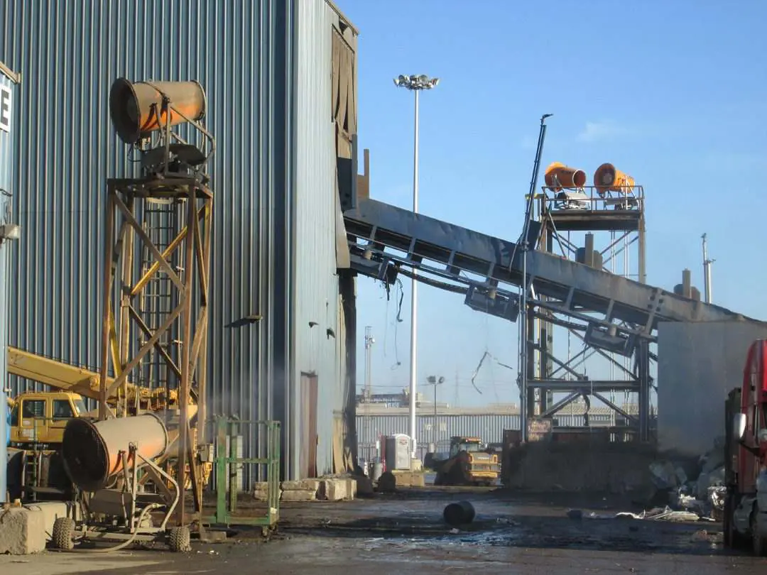 A large industrial building for dust control in scrap metal recycling, located in the USA.