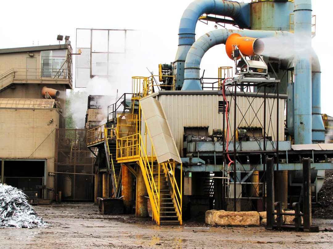 Scrap shredder dust suppression with a mounted system in the USA